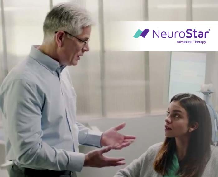 Physician talking with patient about NeuroStar